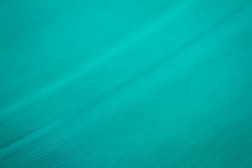 Macro shot of cyan vinyl record. Surface of an old vinyl record. Shallow depth of field.