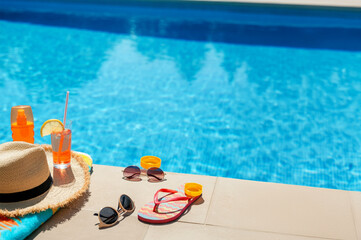 Summer holiday accessories by the swimming pool.