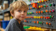 © YURY YUTY - A child smiling while playing with colorful pegs and a board, fostering creativity and motor skills development.