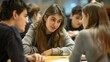 © Anna - High school students collaborating in group discussion