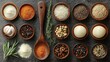 © Iurii - An assortment of spices, herbs, and aromatics is neatly organized in wooden bowls on a dark surface