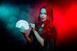 © Beauty Hero - Photo of lady hold choose playing poker cards wear dark cape cloak isolated neon mist filter background
