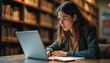 © DWIJ - Beautiful Caucasian Female Student Working on a Laptop Computer in the Library.
