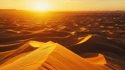 A desert landscape with a cloudy sky and a sun setting in the background