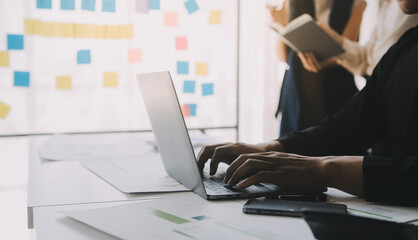 financial analysts analyze business financial reports on a digital tablet planning investment projec