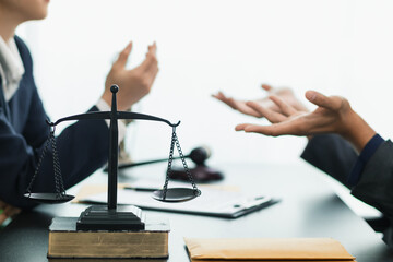 a brass scale is placed on a table in a lawyer office as a decoration and symbol of justice in the judicial process. The brass scales symbolize justice in court proceedings.Copy Space for text