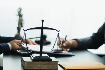 a brass scale is placed on a table in a lawyer office as a decoration and symbol of justice in the judicial process. The brass scales symbolize justice in court proceedings.Copy Space for text