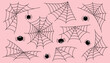 © Julia Anisimova - Set of Halloween black spider webs on pink background. Halloween concept. Halloween objects.
