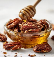 glass bowl filled with nuts and honey