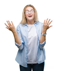 Young caucasian business woman wearing glasses over isolated background celebrating crazy and amazed for success with arms raised and open eyes screaming excited. Winner concept