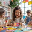 © Muhawaii - Three happy kids learning letters in a classroom setting.