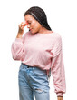 © Krakenimages.com - Young braided hair african american girl wearing sweater over isolated background tired rubbing nose and eyes feeling fatigue and headache. Stress and frustration concept.