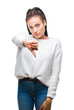 © Krakenimages.com - Young braided hair african american girl wearing winter sweater over isolated background looking unhappy and angry showing rejection and negative with thumbs down gesture. Bad expression.