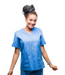 © Krakenimages.com - Young braided hair african american girl professional nurse over isolated background with a happy and cool smile on face. Lucky person.