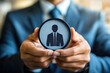 © Worrapol - The Perfect Candidate: A businessman holds a silhouette of a professional, symbolizing the ideal candidate for a leadership position, recruitment, or career opportunity. A powerful and visually striki