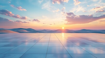 A beautiful sunset reflects off a large, modern tiled terrace, creating a tranquil and expansive scene with soft light and distant mountains.