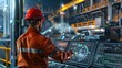 © VK Studio - A worker in a red helmet operates intricate machinery in an advanced industrial facility, showcasing the precision and modernity of the environment.