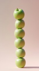 A stack of green apple slice fruit balancing on top with solid background