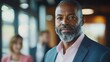 © Synthetica - A man with a beard and gray hair is wearing a suit and smiling