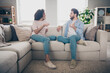 © deagreez - photo of positive girl guy sit divan couch speak talk in apartment flat indoors