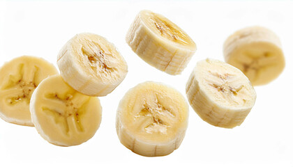 several banana slices falling on a white background, full field