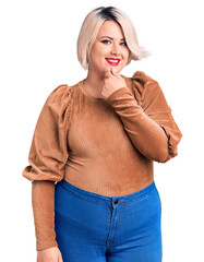 Wall Mural - Young blonde plus size woman wearing casual sweater looking confident at the camera with smile with crossed arms and hand raised on chin. thinking positive.