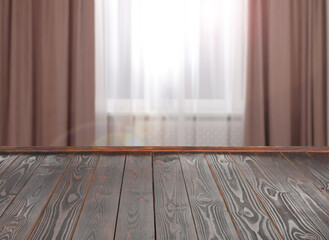 Wall Mural - Empty wooden table near window with curtains. Space for design