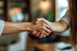 © Mariya Sorvacheva - Handshake after a successful deal: Mortgage success: the moment of signing a loan agreement.
