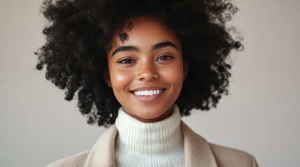 Wall Mural - Portrait of a smiling young woman with afro hair.