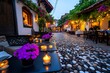 © Sanchai - Beautiful cozy street, soft candlelight, intimate atmosphere creates a romantic setting with cafes and restaurants glowing in the evening light