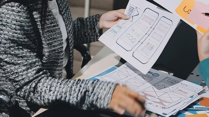 The designer team is designing the uxui system to make the uxui system work well on new phones and support system updates. Website development concept UI UX front end designer