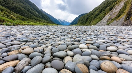 Poster - A large field of rocks and grass with mountains in the background, AI