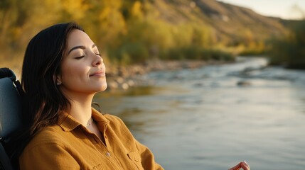 Wall Mural - Serene Latina Woman with Physical Disability Meditating by River - Inner Peace and Resilience.