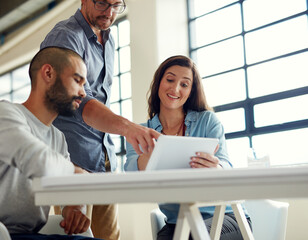 Poster - Employees, people and happy on tablet at office in meeting with teamwork, collaboration and ideas web designer. Business, coworking and smile in boardroom on website for review on creative project
