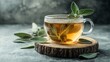 © Elshad Karimov - Savory sage mint herbal tea in a transparent cup, adorned with fresh leaves on a wooden base. Capturing the essence of nature's healing remedies, this image evokes the concept of traditional herbal