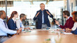 © peopleimages.com - Mature, people or architecture director in meeting for engineering, discussion and building project. Developers, paperwork and designers talking in office for development, blueprint and documents