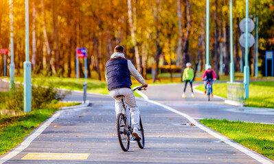 Cyclist ride on the bike path in the city Park 