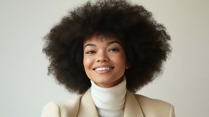 Wall Mural - Portrait of a smiling young woman with an afro.