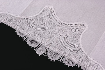 Northeast Brazilian Renaissance lace placemat, isolated on black backgrounds.