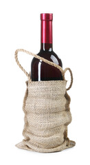 Wall Mural - Wine bottle in burlap bag isolated on white