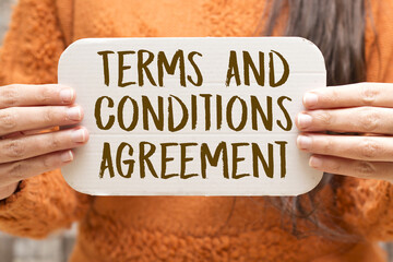 woman holding a white paper with terms and conditions agreement concept