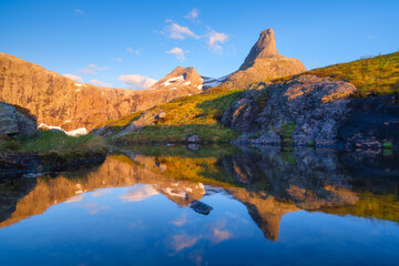 Wall Mural - norway. mountain landscape. view of a high mountain in a valley. huge sharp rocks and reflection on 