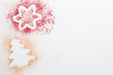 Wall Mural - Christmas tree and star made of powder and blush on white background, top view. Space for text