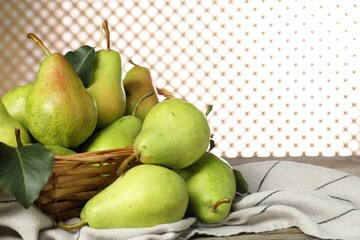 Wall Mural - Fresh green pears and leaves on wooden table, closeup. Space for text