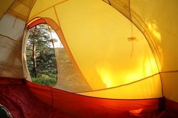 Sticker - Modern camping tent in wilderness at summer, view on forest through window