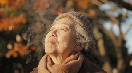 Canvas Print - A person exhaling smoke while having their eyes shut, possibly indicating relaxation or meditation