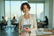 © Alfred - Businesswoman with tablet in modern office
