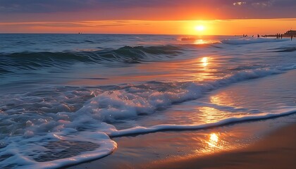 Wall Mural - The setting sun shines on the sea, the waves are gently lapping on the beach, and people are playing in the distance, creating a tranquil and warm atmosphere.