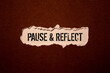 © Uladzislau - Pause and reflect word on a business card on a red notebook