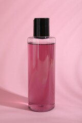 Wall Mural - One shampoo in bottle on pink background